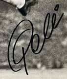 A close-up of a black ink Pele signature on a grayscale background, featured on the Sports Integrity Pele Signed 16x20 Soccer Bicycle Kick Photo Fanatics.