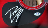 A close-up of the Sports Integrity Post Malone Signed 41" Red Acoustic Guitar shows a silver autograph on the pickguard and a PSA/DNA hologram, with part of the sound hole and label also visible.
