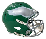 The Sports Integrity Quinyon Mitchell Signed Eagles Full Size Kelly Green Speed Replica Helmet features a gray facemask, silver and white wing design, and a white autograph with the number 27 on top.