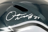 A close-up of a Quinyon Mitchell signed Philadelphia Eagles full size Speed Replica helmet by Sports Integrity, featuring a white autograph with the number 27 above a black and white design.