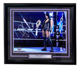 The Sports Integrity Rhea Ripley Signed Framed 16x20 WWE Elimination Chamber Photo by Fanatics features Ripley in black gear holding her championship, with “Rhea Ripley” on the nameplate and purple-accented matting.