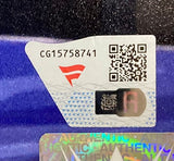 A close-up of a Sports Integrity sticker with code CG15758741, red logo, QR code, and holographic "AUTHENTIC," on the Rhea Ripley Signed Framed 16x20 WWE Elimination Chamber Photo Fanatics, set against a blue and black background.