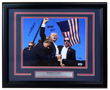 Sports Integrity Robert O'Neill Signed Framed 11x14 Trump Assassination Attempt Photo with "NEVER QUIT!" and O’Neill's signature, featuring him raising his fist amid security and an American flag. Authenticated by PSA.