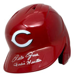 A Pete Rose Signed Cincinnati Reds Full Size Batting Helmet by Sports Integrity, featuring the iconic white "C" logo and autographs on the brim.