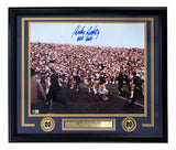 The Sports Integrity Rudy Ruettiger Signed Framed 16x20 Notre Dame Photo “Never Quit” features his blue ink autograph, a plaque with "Rudy Ruettiger Notre Dame Fighting Irish #45," and two Notre Dame logos.