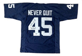 The Sports Integrity Rudy Ruettiger Notre Dame Blue Football Jersey features "NEVER QUIT" and white number 45, with two signatures below the number. Authenticated by BAS.