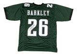 Sports Integrity Saquon Barkley Philadelphia Signed Green Football Jersey PSA/DNA ITP features "Barkley" and number 26 in white with black outlines; the back is autographed in black marker.