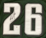 Sports Integrity Saquon Barkley Signed Green 2024 SB Stat Football Jersey with a large white number 26 (black outline), signature on the left digit in black marker, and PSA/DNA authenticity tag below the numbers.
