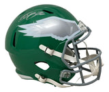 Saquon Barkley Signed Eagles FS Kelly Green Replica Speed Helmet by Sports Integrity, features a white and silver wing logo, gray facemask, white chin straps, and his signature in silver. PSA authenticated.