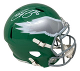 The Sports Integrity PRE ORDER Saquon Barkley Signed Eagles Full Size Kelly Green Replica Speed Helmet features a white and silver wing logo, gray facemask, white chin strap, and Barkley's autograph on top.