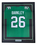 The Sports Integrity Saquon Barkley Philadelphia Kelly Green football jersey #26 is autographed, features white lettering, and comes framed in black with a nameplate. JSA authenticated.