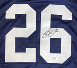 The Sports Integrity Saquon Barkley Penn State Signed Navy Blue Football Jersey features a large white number 26, Barkley's black marker signature on the right digit, and a PSA/DNA authentication sticker at the bottom.