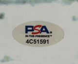 A white oval sticker with the PSA logo, IN-THE-PRESENCE™, and ID 4C51591 is on this Sports Integrity Saquon Barkley Signed Framed 16x20 Eagles Snow Game vs Rams Photo.