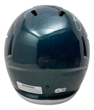 The Saquon Barkley Signed Philadelphia Eagles FS Replica Speed Helmet by Sports Integrity is shown from the back, displaying ventilation holes, a warning label, a certification sticker, and a glossy finish that reflects the photographer.