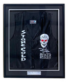 The Sports Integrity Stone Cold Steve Austin Signed Framed WWE Skull Vest BAS features a black vest with bold Stone Cold lettering, a skull graphic, autograph, and a plaque reading: “‘Stone Cold’ Steve Austin.”.