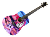 The Sports Integrity T Swift Signed 41" Eras Pink Graphic Acoustic Guitar features a vibrant design with Taylor Swift performing, her autograph, an extra portrait on the body, six strings, and metallic tuning pegs. JSA hologram included.