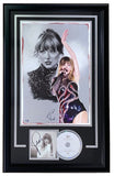 The Sports Integrity Taylor Swift Signed Framed TTPD Insert features a 13x19 lithograph signed by Tony Santiago, complete with PSA+SI authentication.