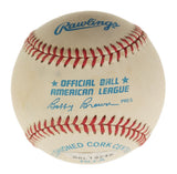 A close-up of a Ted Williams Red Sox signed Official American League baseball by Sports Integrity, featuring red stitching, blue lettering, and JSA authentication (ZZ44383).