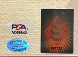 A close-up of two authentication stickers and a Ted Williams Signed Framed 16x20 Boston Red Sox Hall Of Fame Photo by Sports Integrity, with PSA/DNA LOA sticker A009842 and STACKS OF AUTHENTIC SIGNATURES PLAQUES blue sticker visible.