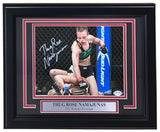 The Sports Integrity Thug Rose Namajunas Signed Framed 8x10 UFC Photo (authenticated by PSA/DNA) features Rose in the octagon delivering punches, with a plaque that reads "THUG ROSE NAMAJUNAS UFC Women's Flyweight.