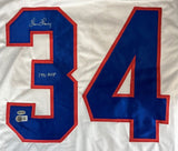 The Sports Integrity Thurman Thomas Buffalo signed white football jersey features bold blue and red outlined number 34, a signature above the left digit, “1991 MVP” below, and authentication stickers on the lower left.
