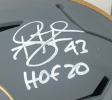 A close-up of a Troy Polamalu Signed Steelers FS Authentic Slate Speed Flex Helmet from Sports Integrity, autographed in white marker with the number 42 and "HOF 20" beneath the signature.