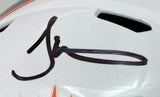 A close-up of the Tyreek Hill Signed Miami Dolphins Full Size Speed Replica Helmet by Sports Integrity, featuring a bold black autograph and visible orange and aqua team colors at the bottom.