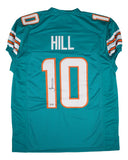 The Sports Integrity Tyreek Hill Miami Signed Teal Pro-Cut Football Jersey features white and orange accents, "HILL" and the number 10 on the back, with Hill’s signature on the number 1.