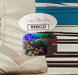 Close-up of two authentication stickers on a Mike Tyson Signed 16x20 Evander Holyfield Ear Bite Fight Photo by Sports Integrity: a white oval with “ISA WB591223” and a rectangular holographic “HITERMAN SPORT” sticker.