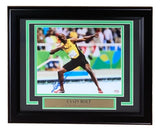 The Sports Integrity Usain Bolt Signed Framed 8x10 Olympic Track Legend Photo features a victory pose, comes with a PSA hologram (AO93029), and includes an autograph and plaque celebrating his 8x Olympic gold medal wins.