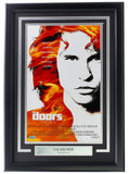 The Sports Integrity Val Kilmer Signed Framed 11x17 The Doors poster photo features a black-and-white image of Val Kilmer as Jim Morrison with orange hair and includes a plaque reading "VAL KILMER Jim Morrison." Authenticated by JSA.