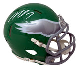 The Sports Integrity Michael Vick Signed Philadelphia Eagles Kelly Green Mini Speed Helmet features a silver eagle wing logo, white autograph on top, gray facemask, and white chin strap.