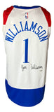 The Sports Integrity Zion Williamson Signed Pelicans Nike Swingman Basketball Jersey features white fabric with red and blue accents, displays "Williamson" and the number 1 on the back, plus his signature below the name.